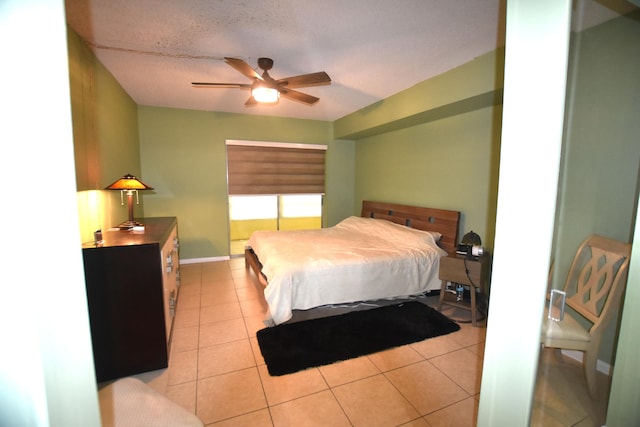 251 NW 76th Ave Unit 105, Margate, FL 33063 - bedroom with light tile patterned floors, baseboards, and ceiling fan