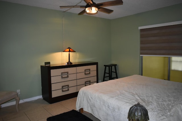 251 NW 76th Ave Unit 105, Margate, FL 33063 - bedroom with light tile patterned floors, ceiling fan, and baseboards