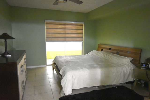 251 NW 76th Ave Unit 105, Margate, FL 33063 - bedroom featuring light tile patterned floors, baseboards, and ceiling fan