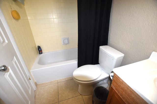 251 NW 76th Ave Unit 105, Margate, FL 33063 - full bathroom featuring toilet, shower / tub combo with curtain, vanity, tile patterned floors, and a textured wall