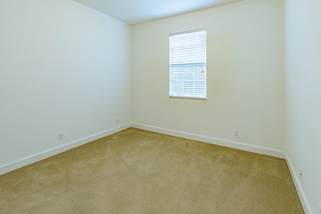 2812 Eagle Rock Cir Unit 902, West Palm Beach, FL 33411 - unfurnished room featuring light colored carpet and baseboards