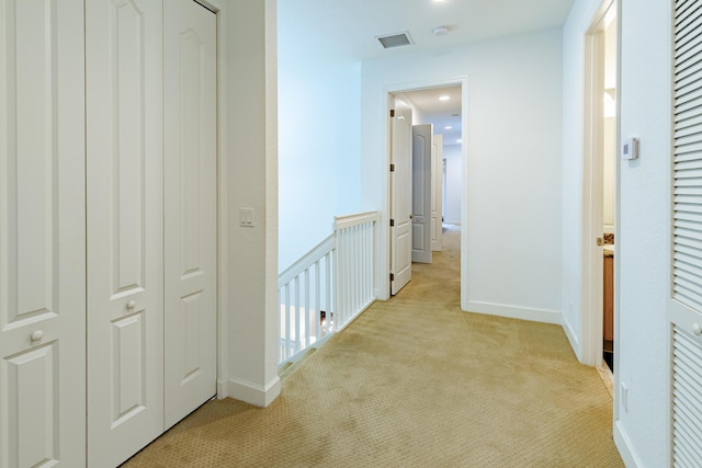 2812 Eagle Rock Cir Unit 902, West Palm Beach, FL 33411 - corridor featuring light colored carpet and an upstairs landing