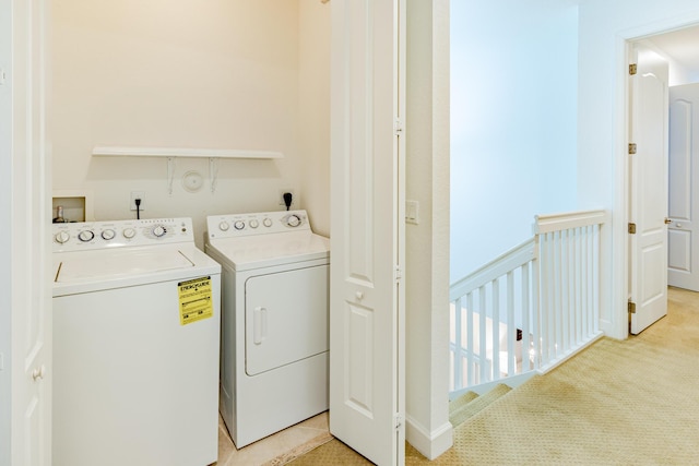 2812 Eagle Rock Cir Unit 902, West Palm Beach, FL 33411 - washroom with washing machine and dryer and light colored carpet
