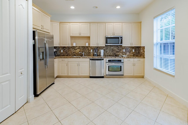 2812 Eagle Rock Cir Unit 902, West Palm Beach, FL 33411 - kitchen with appliances with stainless steel finishes, tasteful backsplash, dark stone counters, and recessed lighting