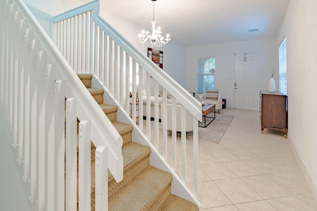 2812 Eagle Rock Cir Unit 902, West Palm Beach, FL 33411 - stairs with a chandelier and tile patterned floors