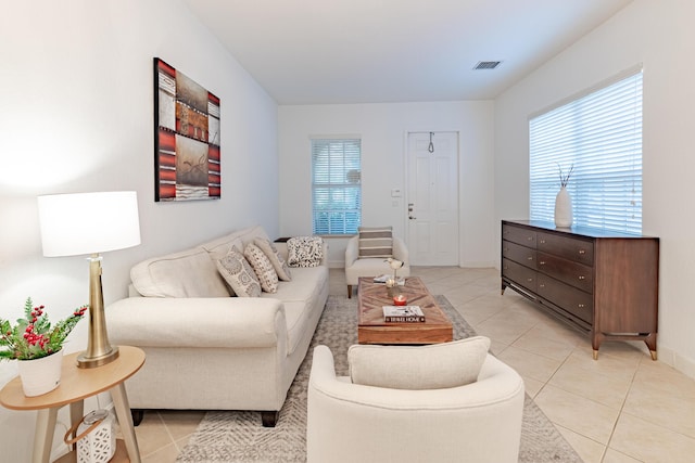 2812 Eagle Rock Cir Unit 902, West Palm Beach, FL 33411 - living room featuring light tile patterned floors and healthy amount of natural light