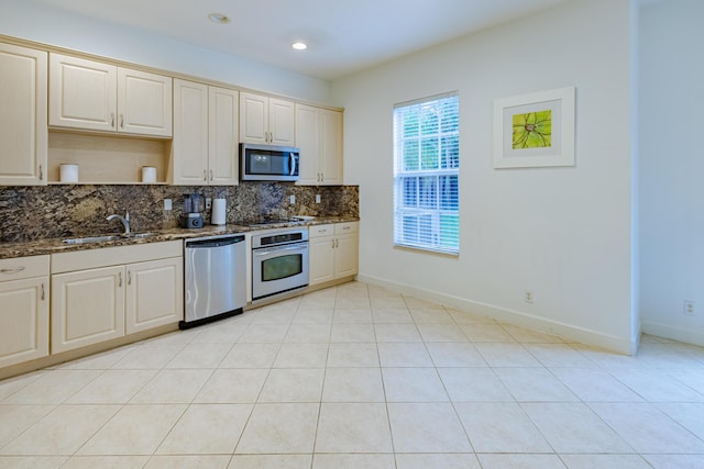 2812 Eagle Rock Cir Unit 902, West Palm Beach, FL 33411 - kitchen with appliances with stainless steel finishes, backsplash, dark stone counters, and recessed lighting