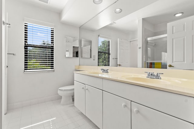 3049 NW 61st St, Boca Raton, FL 33496 - bathroom with double vanity, baseboards, a stall shower, toilet, and tile patterned floors