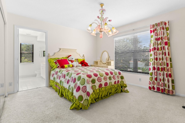 3049 NW 61st St, Boca Raton, FL 33496 - carpeted bedroom with a chandelier, baseboards, and ensuite bathroom