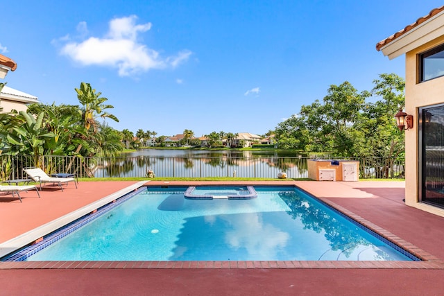 3049 NW 61st St, Boca Raton, FL 33496 - view of pool with a patio, a pool with connected hot tub, and a water view