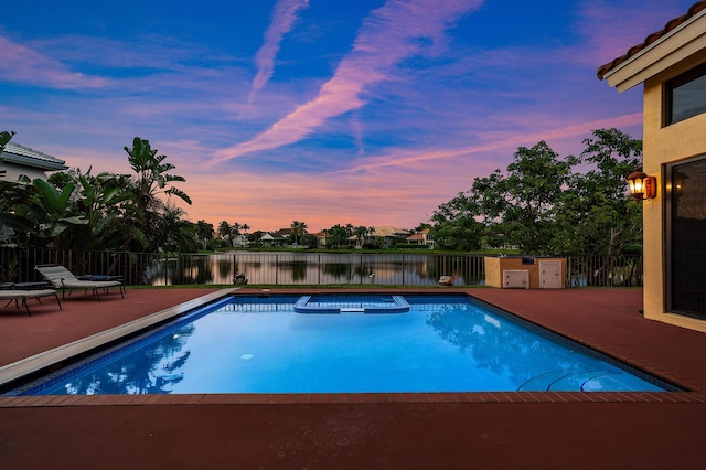 3049 NW 61st St, Boca Raton, FL 33496 - view of pool with a patio, a water view, and a pool with connected hot tub