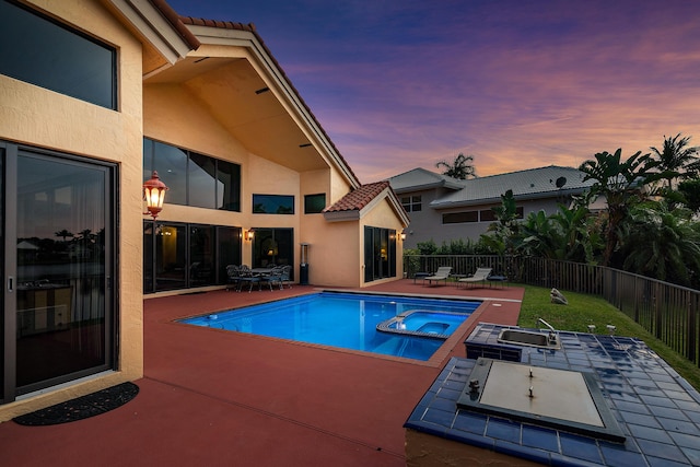 3049 NW 61st St, Boca Raton, FL 33496 - view of pool with a patio area, a sink, a fenced backyard, a pool with connected hot tub, and outdoor dining space