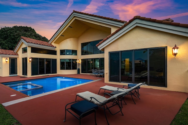 3049 NW 61st St, Boca Raton, FL 33496 - pool at dusk with a patio area and a pool with connected hot tub