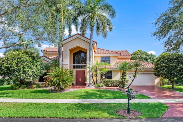 3049 NW 61st St, Boca Raton, FL 33496 - mediterranean / spanish house with a tile roof, stucco siding, a garage, a front yard, and driveway