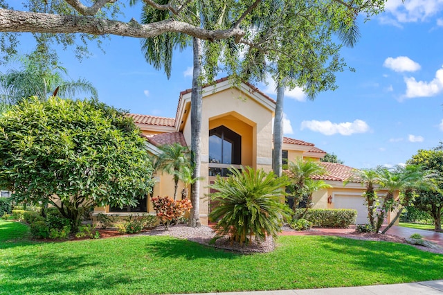 3049 NW 61st St, Boca Raton, FL 33496 - mediterranean / spanish home with a tiled roof, stucco siding, and a garage