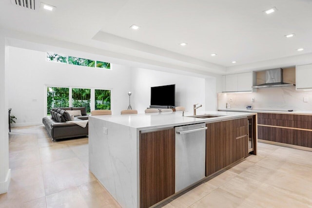 1145 SW 20th St, Boca Raton, FL 33486 - kitchen featuring wall chimney range hood, stainless steel dishwasher, open floor plan, modern cabinets, and recessed lighting