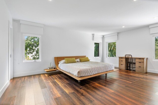 1145 SW 20th St, Boca Raton, FL 33486 - bedroom featuring multiple windows, wood finished floors, recessed lighting, and baseboards