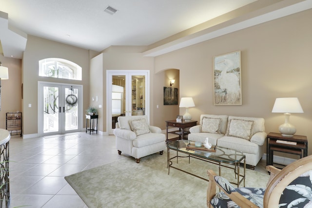 10120 Inverness Way, Port Saint Lucie, FL 34986 - living area with french doors, tile patterned floors, and baseboards