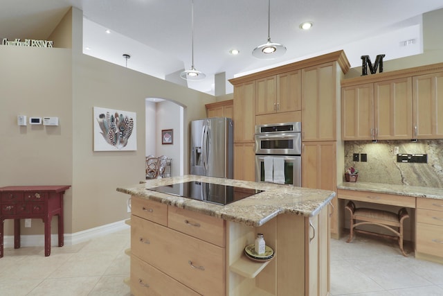 10120 Inverness Way, Port Saint Lucie, FL 34986 - kitchen featuring appliances with stainless steel finishes, light brown cabinets, arched walkways, a center island, and recessed lighting