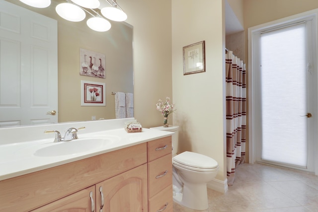 10120 Inverness Way, Port Saint Lucie, FL 34986 - full bathroom with toilet, vanity, tile patterned floors, and curtained shower