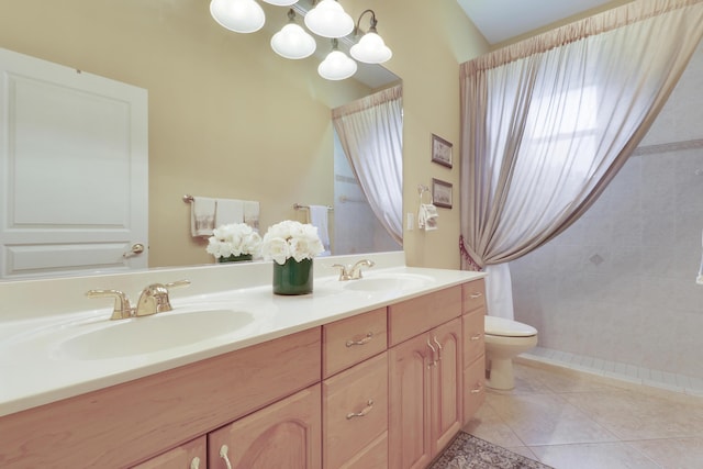 10120 Inverness Way, Port Saint Lucie, FL 34986 - bathroom featuring toilet, a chandelier, double vanity, tile patterned floors, and tiled shower