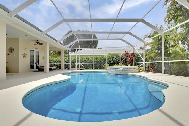 10120 Inverness Way, Port Saint Lucie, FL 34986 - view of pool with a patio area, ceiling fan, a pool with connected hot tub, and glass enclosure