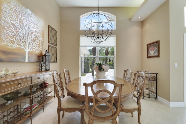10120 Inverness Way, Port Saint Lucie, FL 34986 - dining space with a chandelier, light tile patterned flooring, baseboards, and a towering ceiling