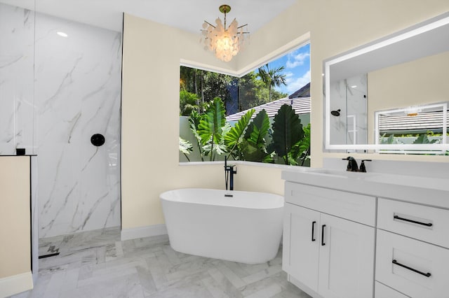 6845 Big Cypress Dr, Jupiter, FL 33458 - bathroom featuring a marble finish shower, a chandelier, marble tiled floors, vanity, and a freestanding bath