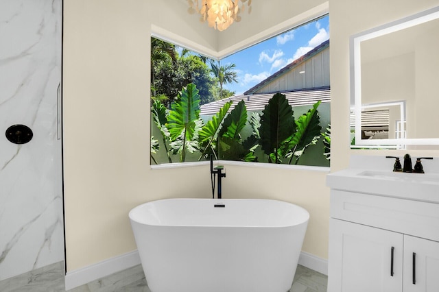 6845 Big Cypress Dr, Jupiter, FL 33458 - bathroom featuring marble finish flooring, a freestanding tub, and vanity
