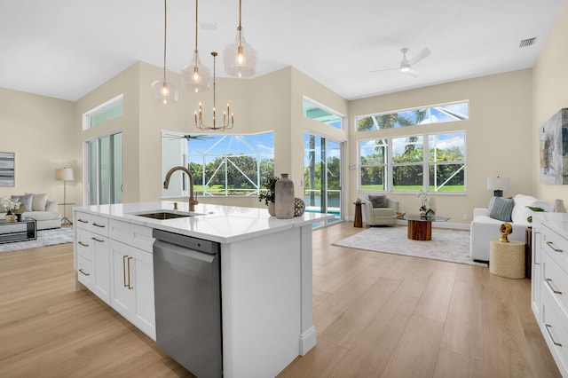 6845 Big Cypress Dr, Jupiter, FL 33458 - kitchen featuring open floor plan, dishwasher, ceiling fan, and light wood-style flooring
