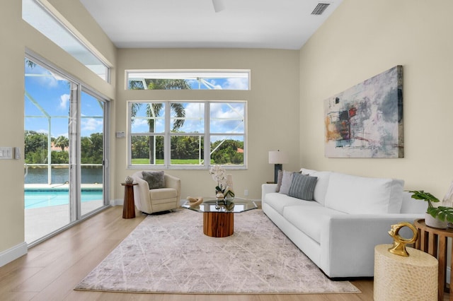 6845 Big Cypress Dr, Jupiter, FL 33458 - living area with plenty of natural light and wood finished floors