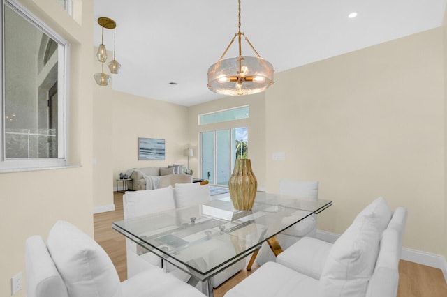 6845 Big Cypress Dr, Jupiter, FL 33458 - dining room featuring light wood-style flooring, a chandelier, and recessed lighting