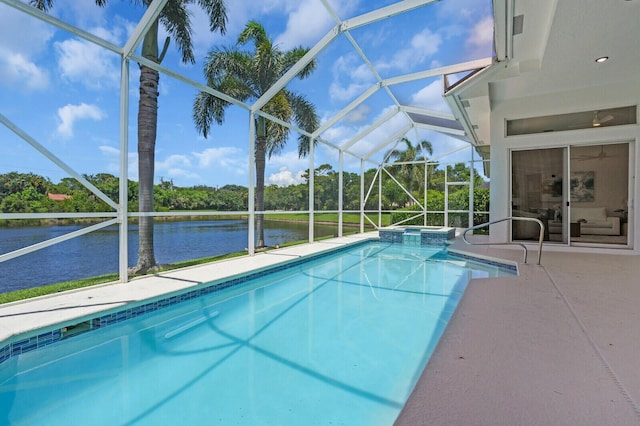6845 Big Cypress Dr, Jupiter, FL 33458 - view of swimming pool with a water view, a lanai, a pool with connected hot tub, and a patio
