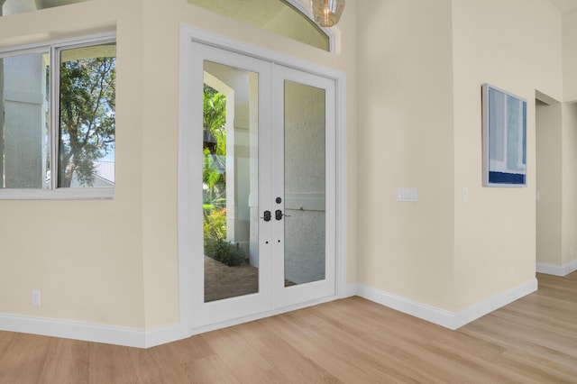 6845 Big Cypress Dr, Jupiter, FL 33458 - entrance foyer featuring wood finished floors, french doors, and healthy amount of natural light