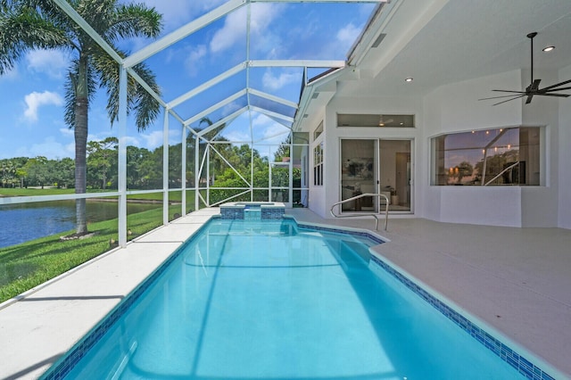 6845 Big Cypress Dr, Jupiter, FL 33458 - view of swimming pool with a patio area, a ceiling fan, a pool with connected hot tub, a water view, and a lanai