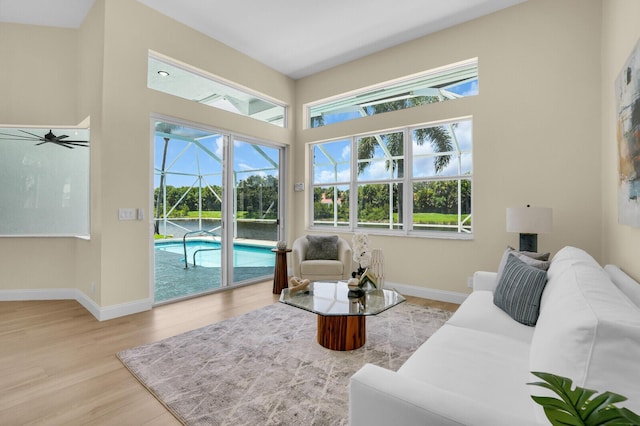 6845 Big Cypress Dr, Jupiter, FL 33458 - living area with a sunroom, wood finished floors, and a ceiling fan