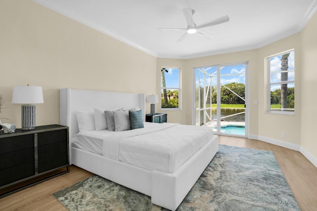 6845 Big Cypress Dr, Jupiter, FL 33458 - bedroom with access to outside, wood finished floors, ornamental molding, and a ceiling fan