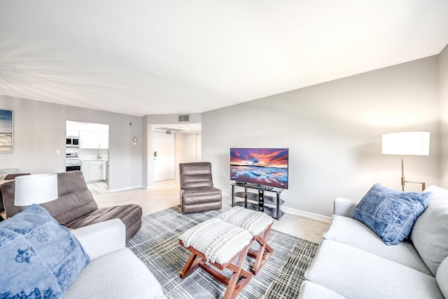 8641 Boca Glades D Blvd W Unit D, Boca Raton, FL 33434 - living room with baseboards and light tile patterned flooring