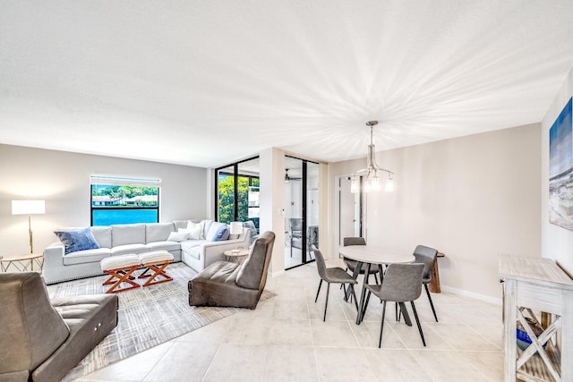 8641 Boca Glades D Blvd W Unit D, Boca Raton, FL 33434 - living room with light tile patterned flooring and a chandelier
