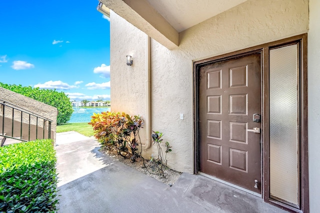 8641 Boca Glades D Blvd W Unit D, Boca Raton, FL 33434 - entrance to property with stucco siding and a water view