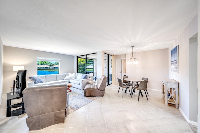 8641 Boca Glades D Blvd W Unit D, Boca Raton, FL 33434 - living area with a chandelier and light tile patterned flooring
