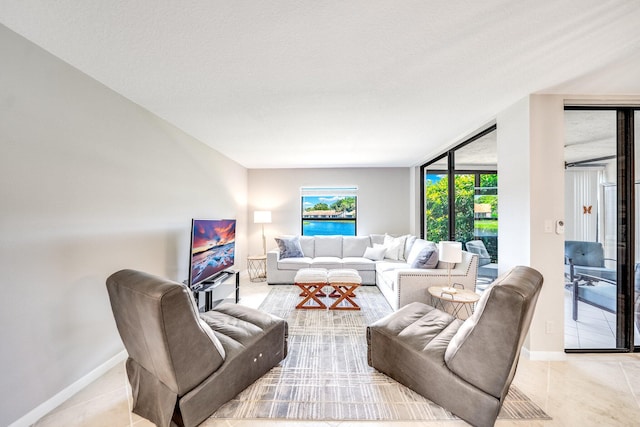 8641 Boca Glades D Blvd W Unit D, Boca Raton, FL 33434 - living area featuring baseboards and light tile patterned flooring