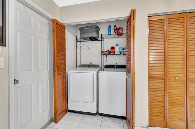 7574 Ironbridge Cir, Delray Beach, FL 33446 - laundry area with light tile patterned flooring and separate washer and dryer