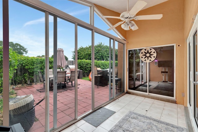 7574 Ironbridge Cir, Delray Beach, FL 33446 - sunroom / solarium featuring outdoor dining space, a ceiling fan, healthy amount of natural light, and a towering ceiling