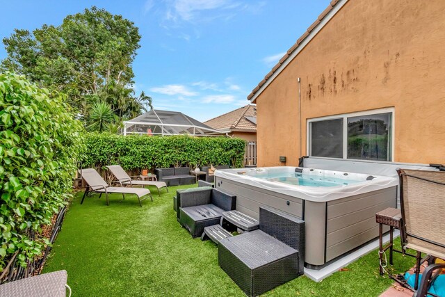 7574 Ironbridge Cir, Delray Beach, FL 33446 - view of patio featuring a hot tub and an outdoor hangout area