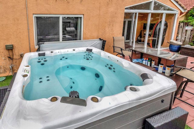 7574 Ironbridge Cir, Delray Beach, FL 33446 - view of patio / terrace featuring a hot tub
