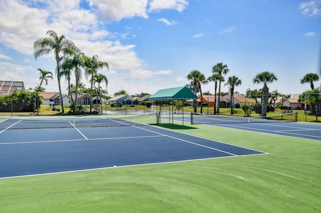 7574 Ironbridge Cir, Delray Beach, FL 33446 - view of tennis court featuring a residential view
