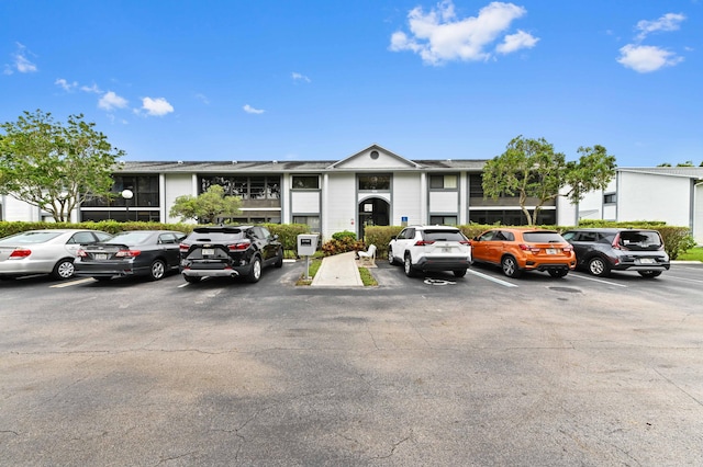 15445 Lakes Of Delray Blvd Unit 105, Delray Beach, FL 33484 - view of property featuring uncovered parking
