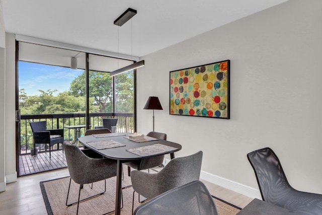 1841 Bridgewood Dr, Boca Raton, FL 33434 - dining space featuring light wood-style flooring, baseboards, and expansive windows