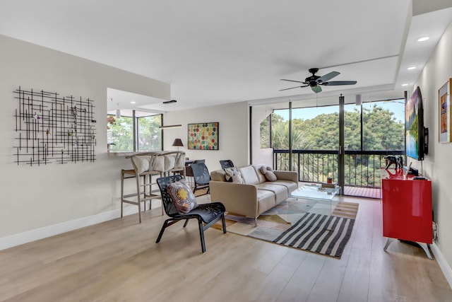 1841 Bridgewood Dr, Boca Raton, FL 33434 - living area with wood finished floors, ceiling fan, baseboards, and floor to ceiling windows